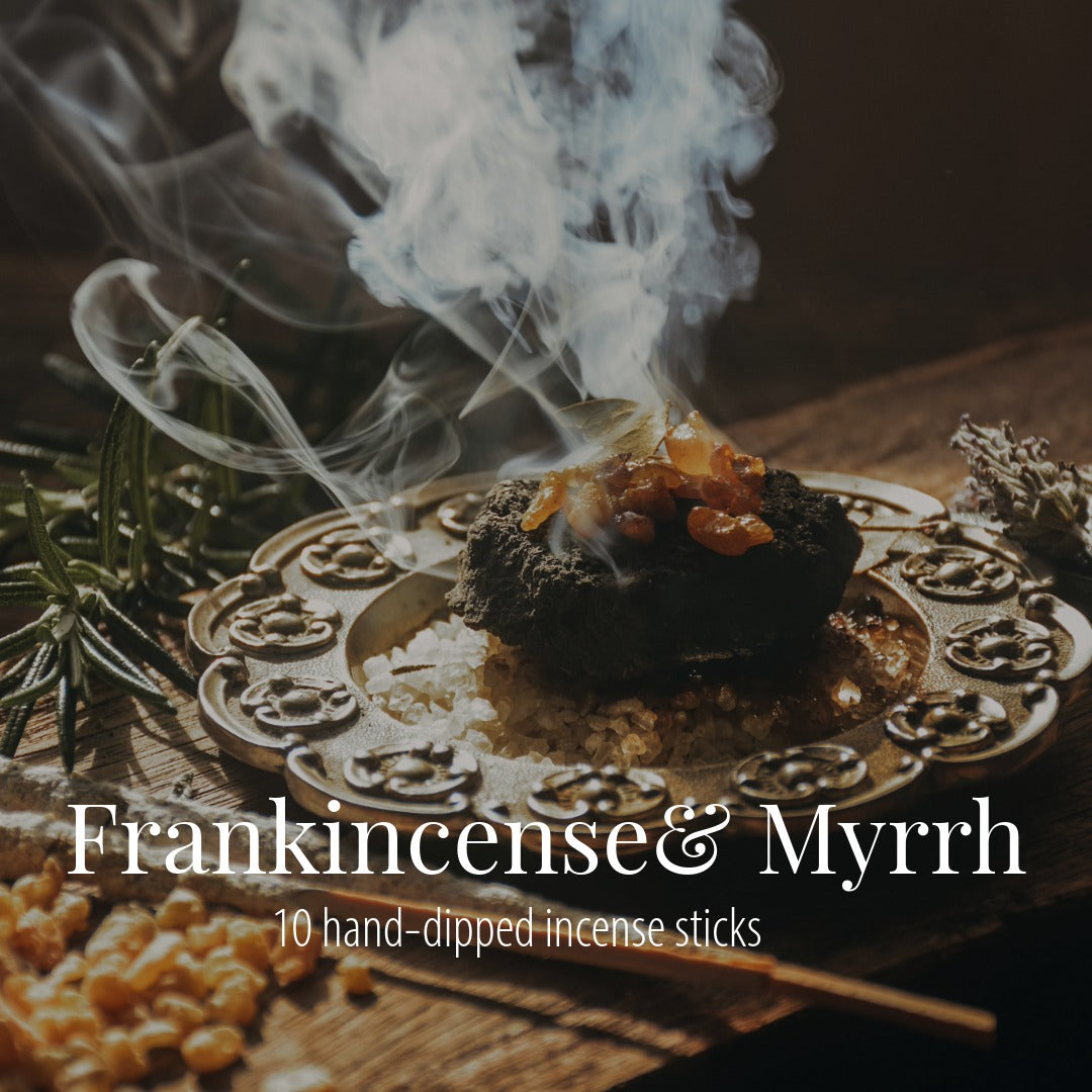 Smoky frankincense resin on a charcoal placed on a pewter dish